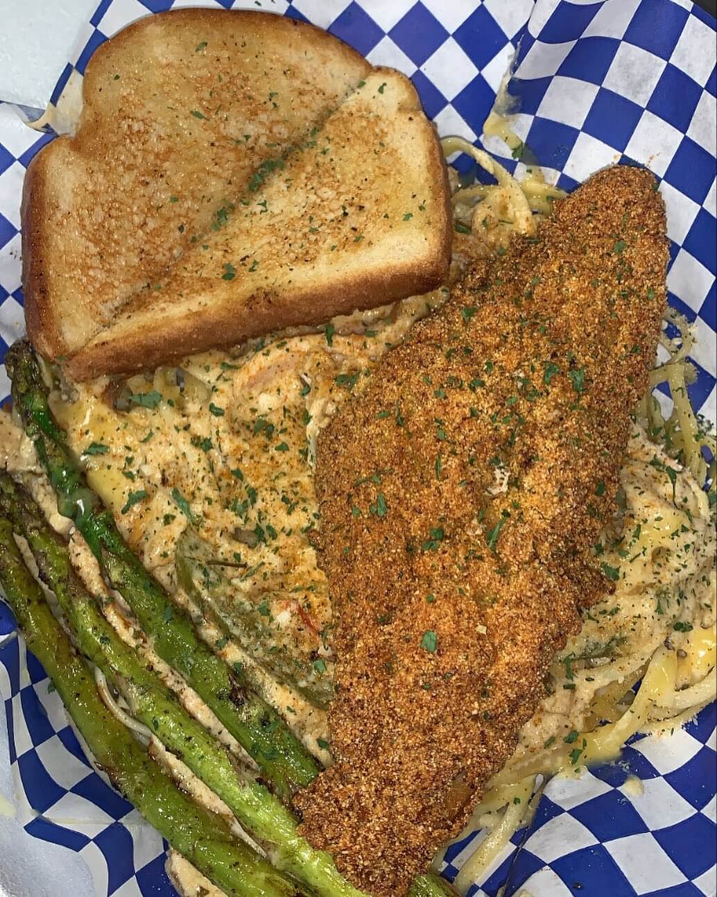 Golden fried catfish basket with seasoned fries from Jaykusteaux