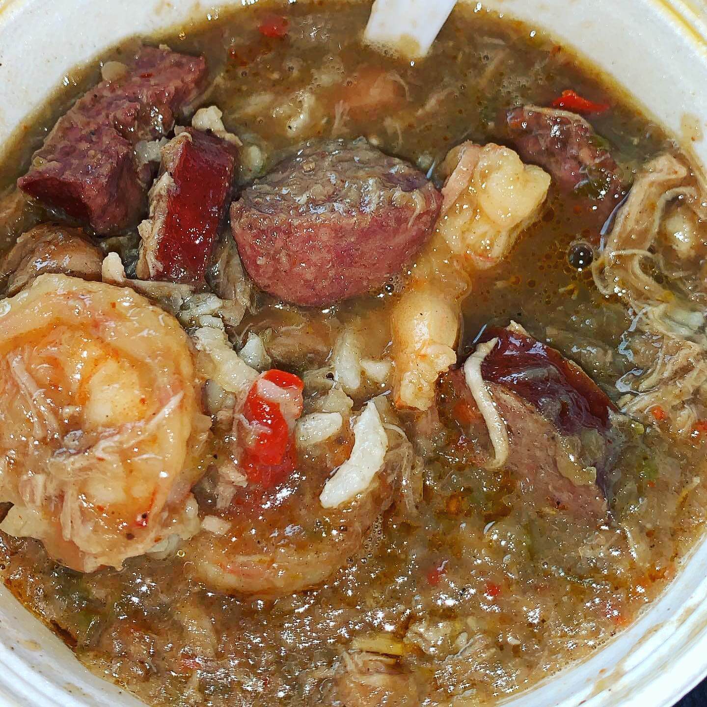 Smoked oxtails with dirty rice plated at the Jaykusteaux food truck